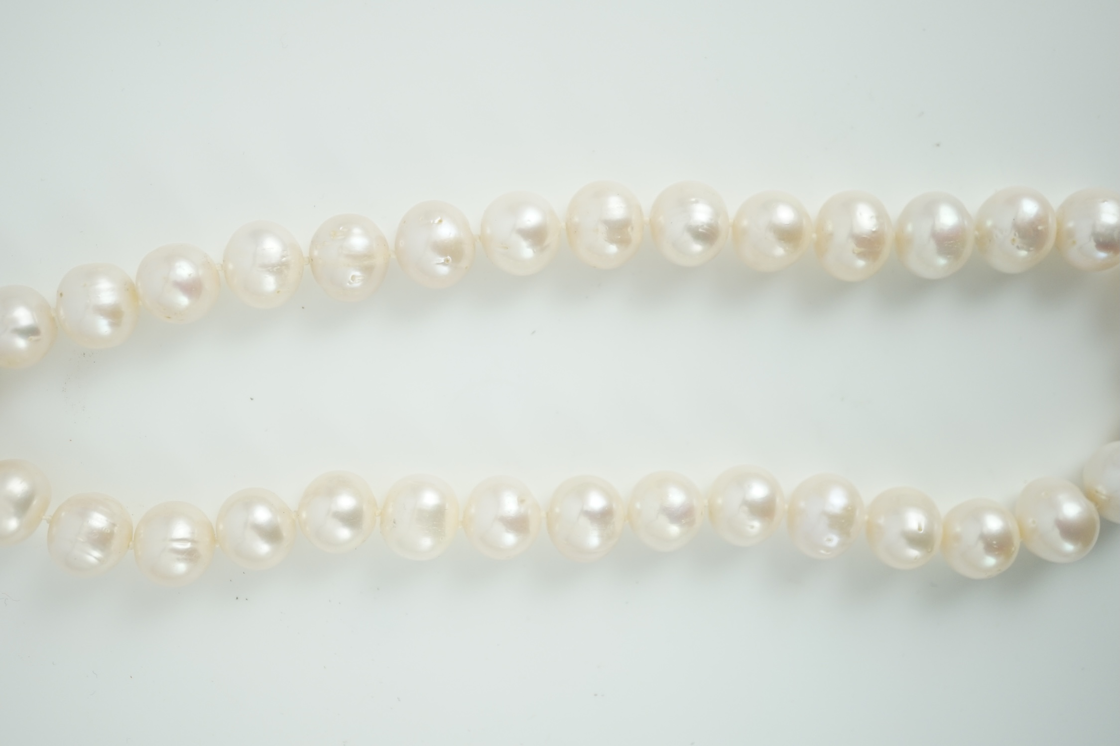 A single strand South Sea? cultured pearl necklace, with 14k yellow metal clasp, 44cm